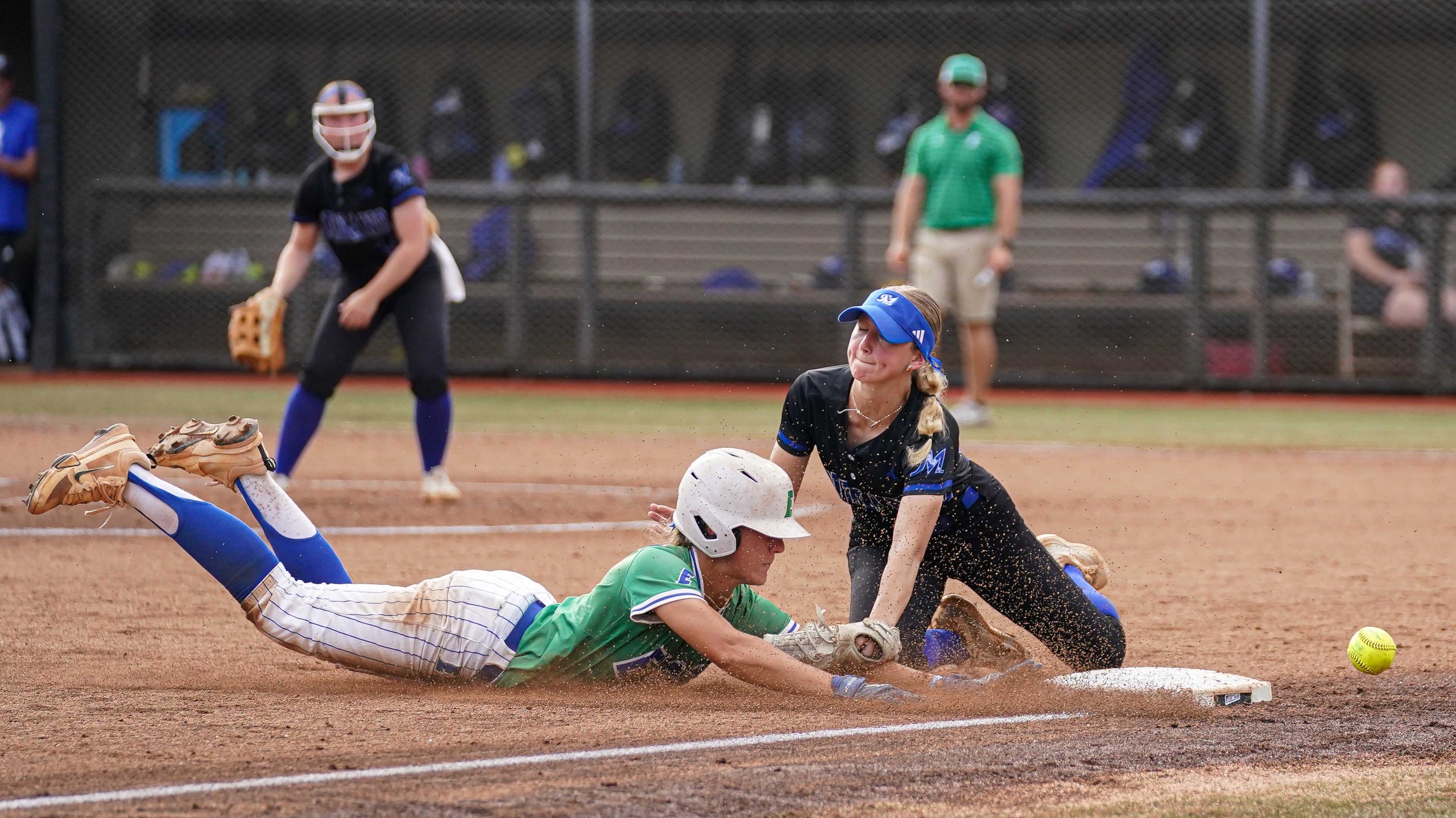 College softball steals third base.