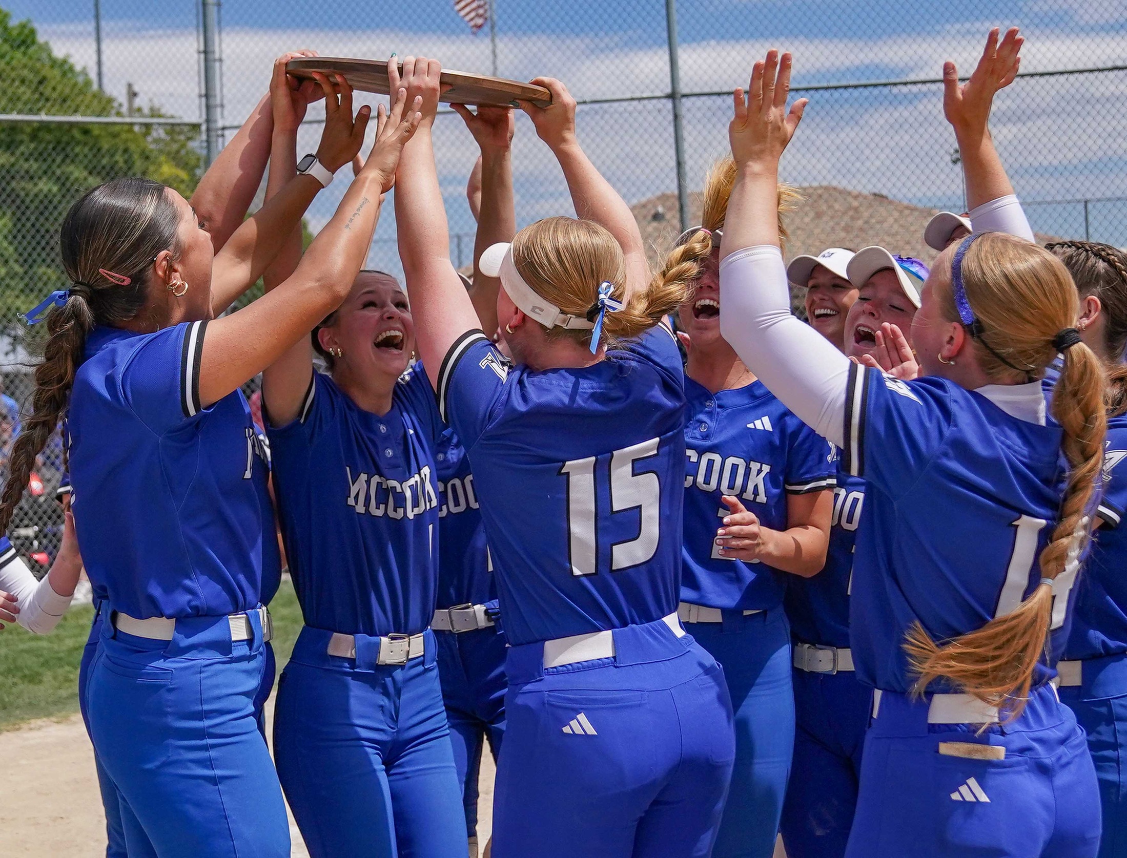 College softball players celebrate championship.